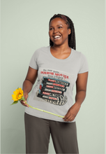 Load image into Gallery viewer, Woman wearing a gray t-shirt with graphic design, holding a sunflower against a light green background